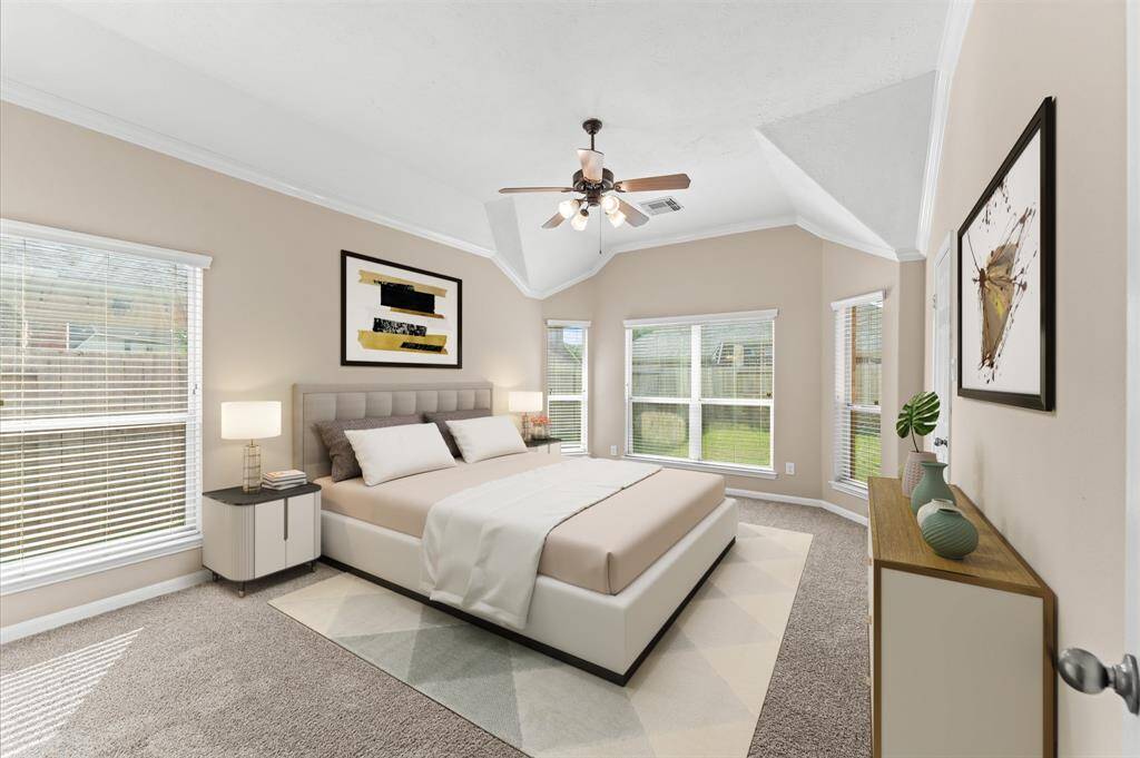 The master's bedroom is spacious and inviting retreat where comfort meets elegance. Wide windows overlook the backyard, bringing in peaceful views of nature.