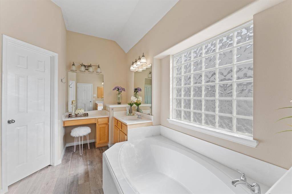 Step into a spa-like retreat with a luxurious garden tub, perfect for relaxing soaks.A separate shower adds convenience while maintaining a sleek and stylish look.