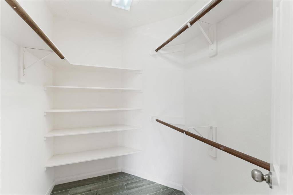 A walk-in closet keeps your wardrobe organized and within easy reach.
