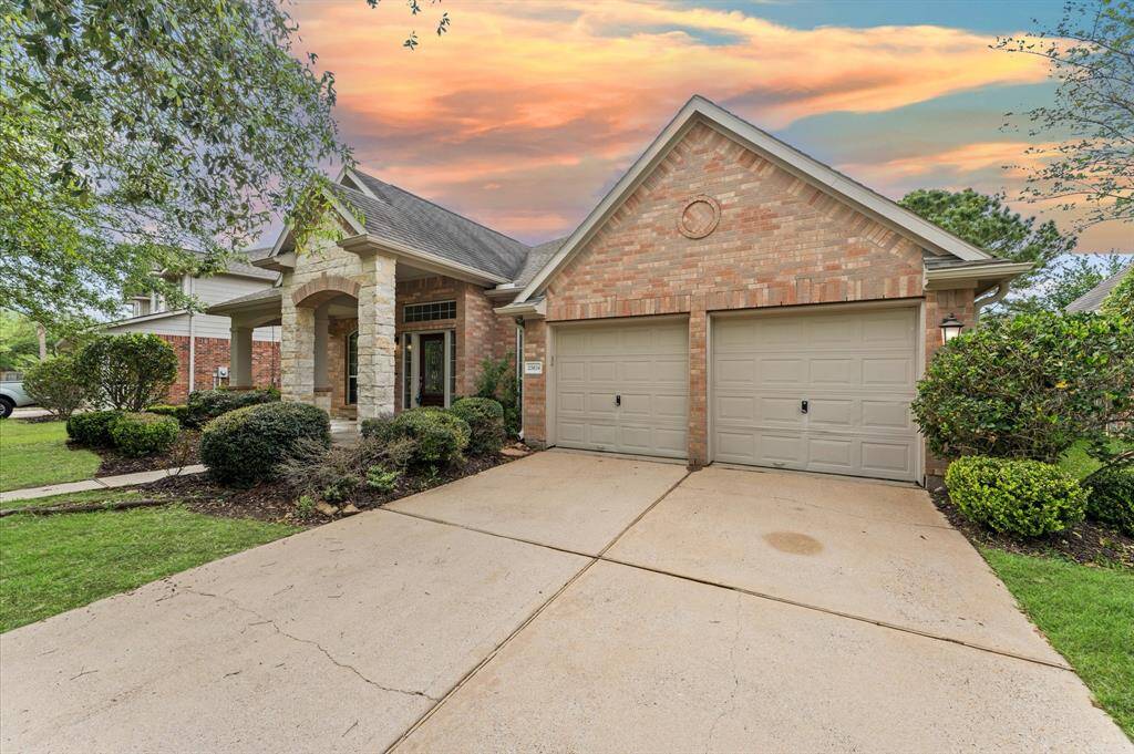 The wide driveway provides ample parking space, perfect for family gatherings.