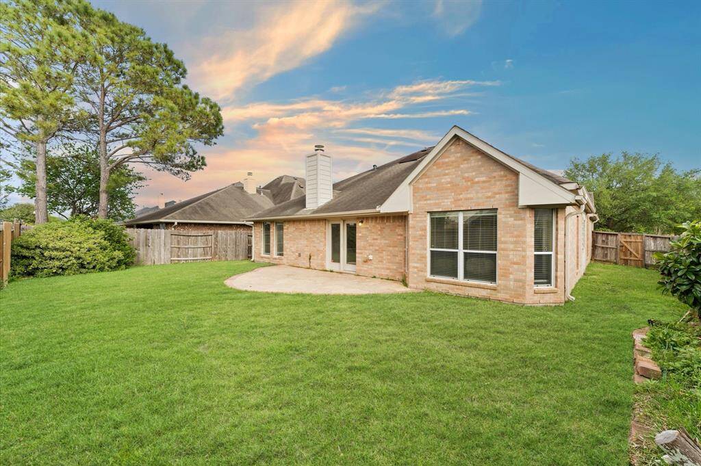 Step into a peaceful outdoor oasis, where lush greenery surrounds you.A spacious yard provides plenty of room for kids to play and run freely.