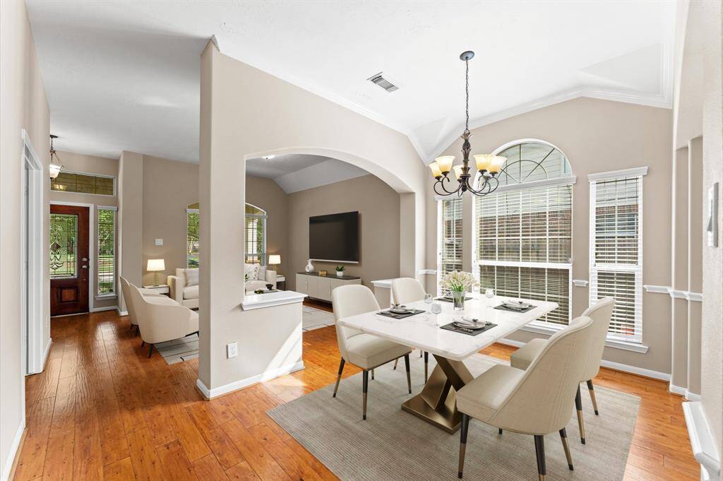 The dining area is bathed in natural light, with wide windows that brighten every mealtime.