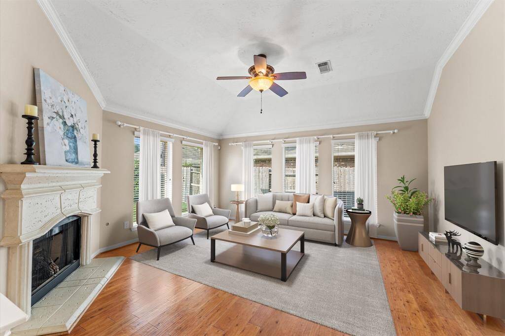The cozy fireplace is the heart of this living room, filling it with warmth and comfort.
