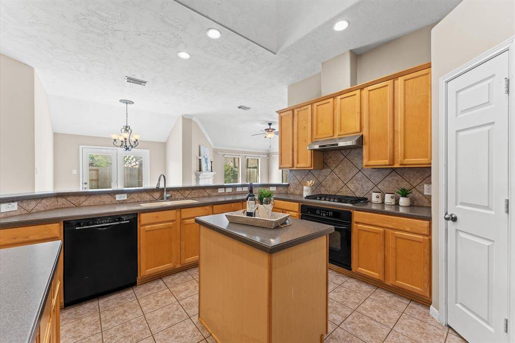 The kitchen is a dream with its island, offering the perfect spot for meal prep and conversation.