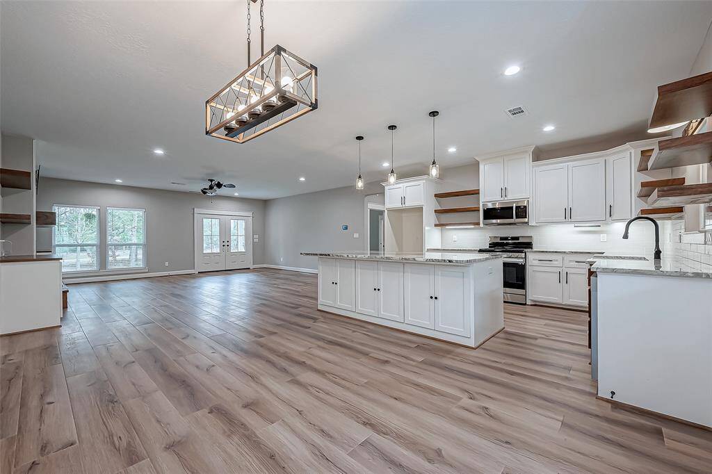 This 4-bed, 2.5-bath beauty has an open layout.