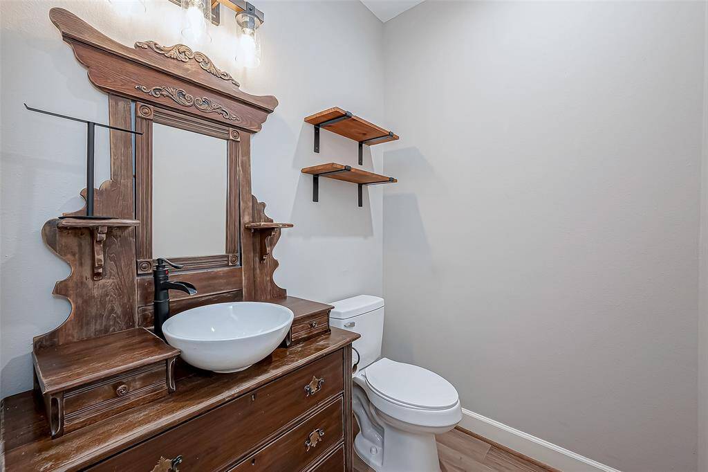 Charming country-style half bath for guests.