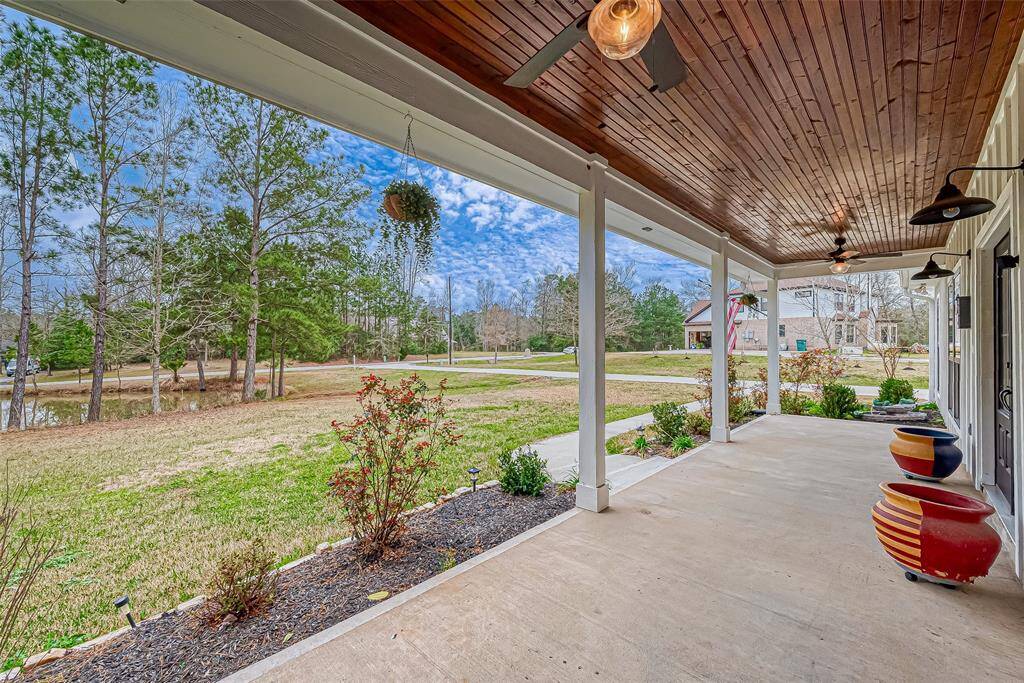 Imagine yourself relaxing on the long 33' front porch.