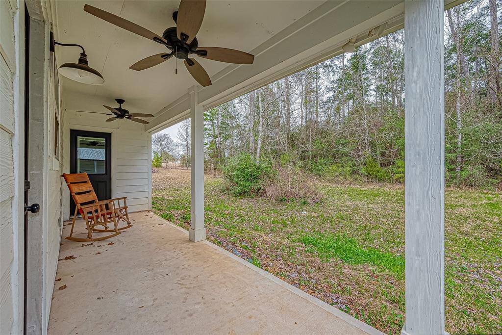 Step out onto the private back porch for some quiet seating.