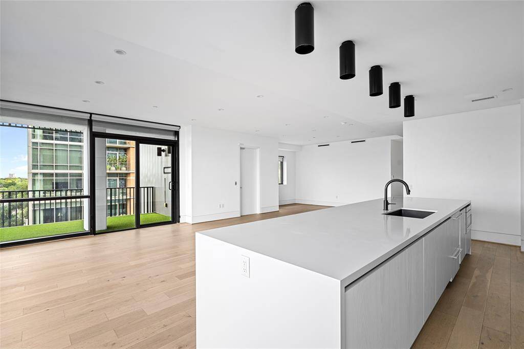 Another view of the living space highlighting its expansive layout.