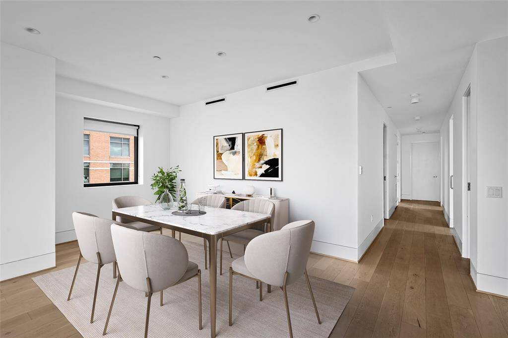 The dining area provides a comfortable space for meals and gatherings. *Virtual staging has been added*