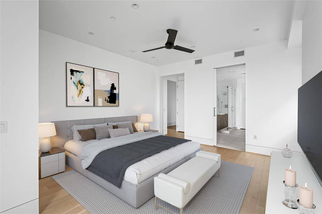 Down the hallway, you'll discover the primary suite, complete with its own private balcony. *Virtual staging has been added*