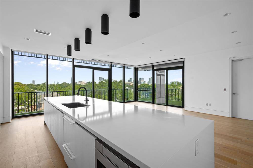 Large floor-to-ceiling windows bathe the living space in natural light, creating a bright and airy ambiance.