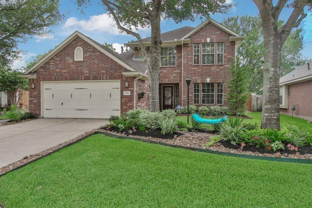 Front of home with beautiful landscaping