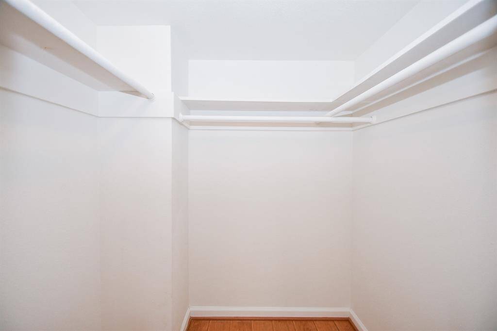 Primary bedroom with walk-in closet
