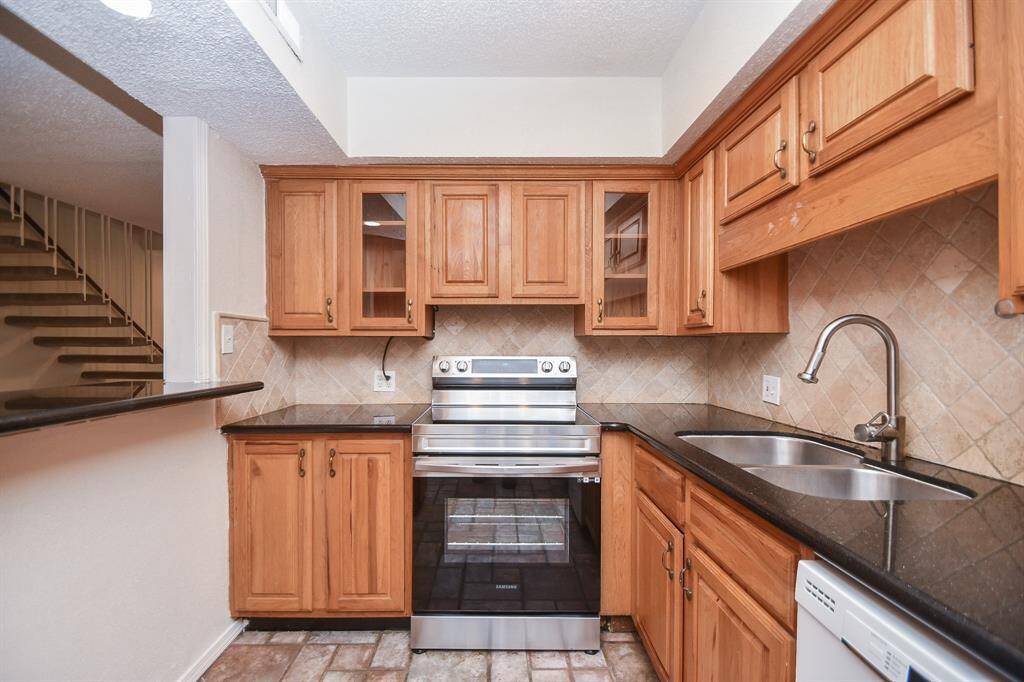 Gorgeous kitchen with Stainless Steel appliances and beautiful cabinets.