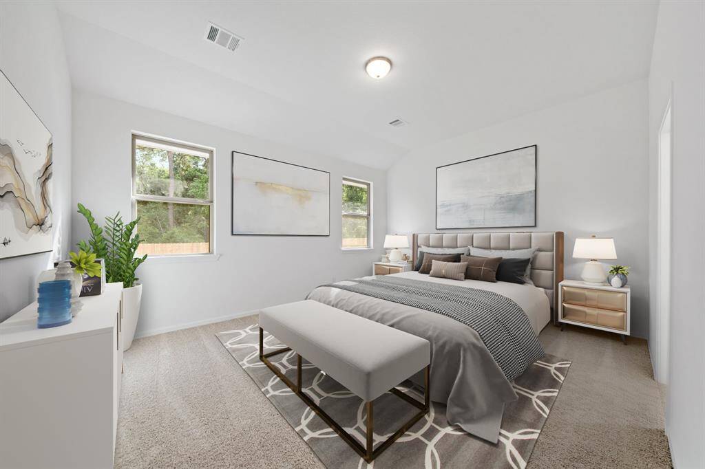 The primary bedroom is generously sized, creating a tranquil and spacious retreat that offers ample room for relaxation. Featuring plush carpet, high ceilings, fresh paint, and large windows that lets in natural lighting throughout the day.