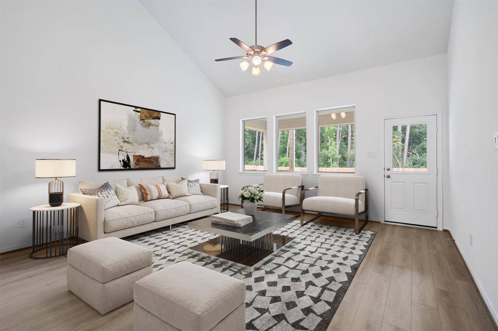 Your family room has ample space to entertain family and friends. This space features beautiful floors, fresh paint, ceiling fan with lighting, and high ceilings.