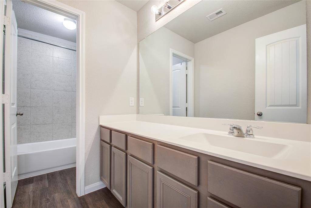 Shared secondary bathroom with seperate vanity area