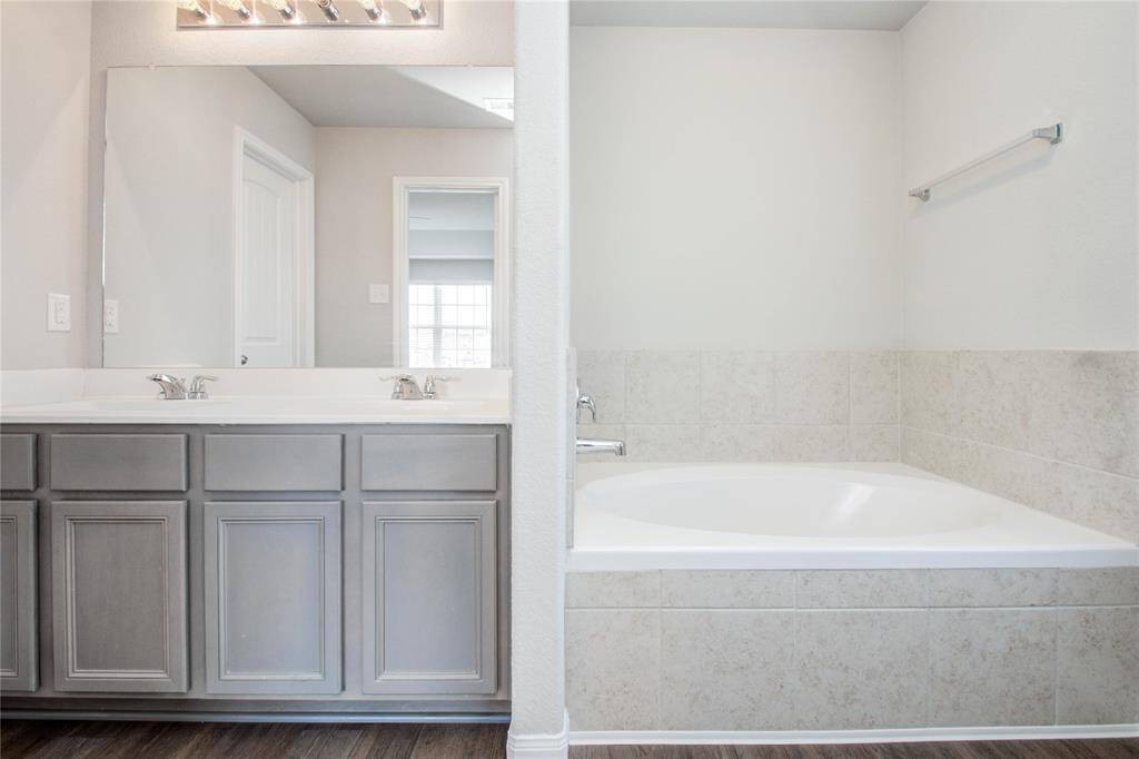Separate soaking tub with shower on other side