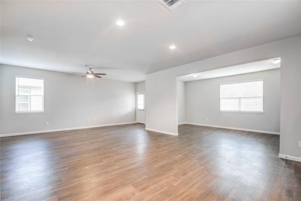 Living area with view of flex room.
