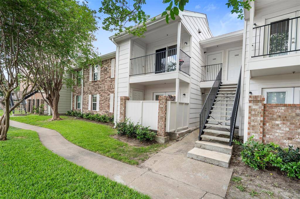 Welcome to this charming ground floor condo with overlooking the tennis courts—perfect for relaxing and enjoying the vibrant community atmosphere right outside your door.