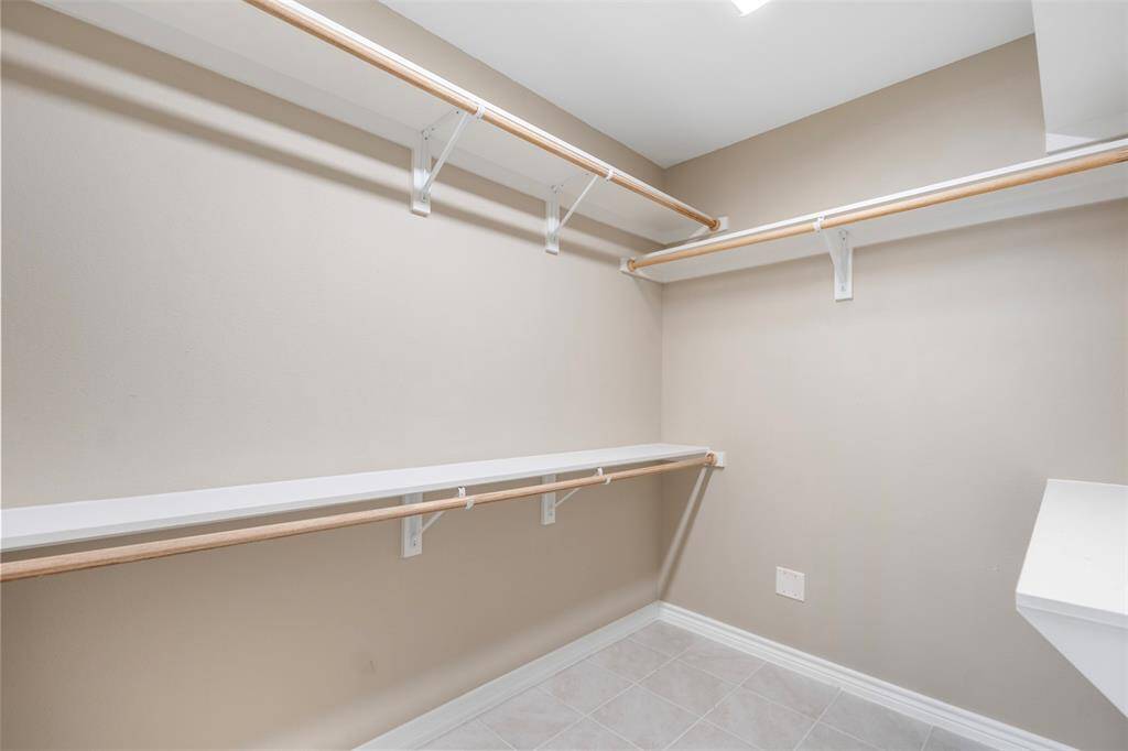 Generously sized walk-in closet in the primary bedroom, providing ample storage space with plenty of room for organization—an ideal blend of functionality and convenience.