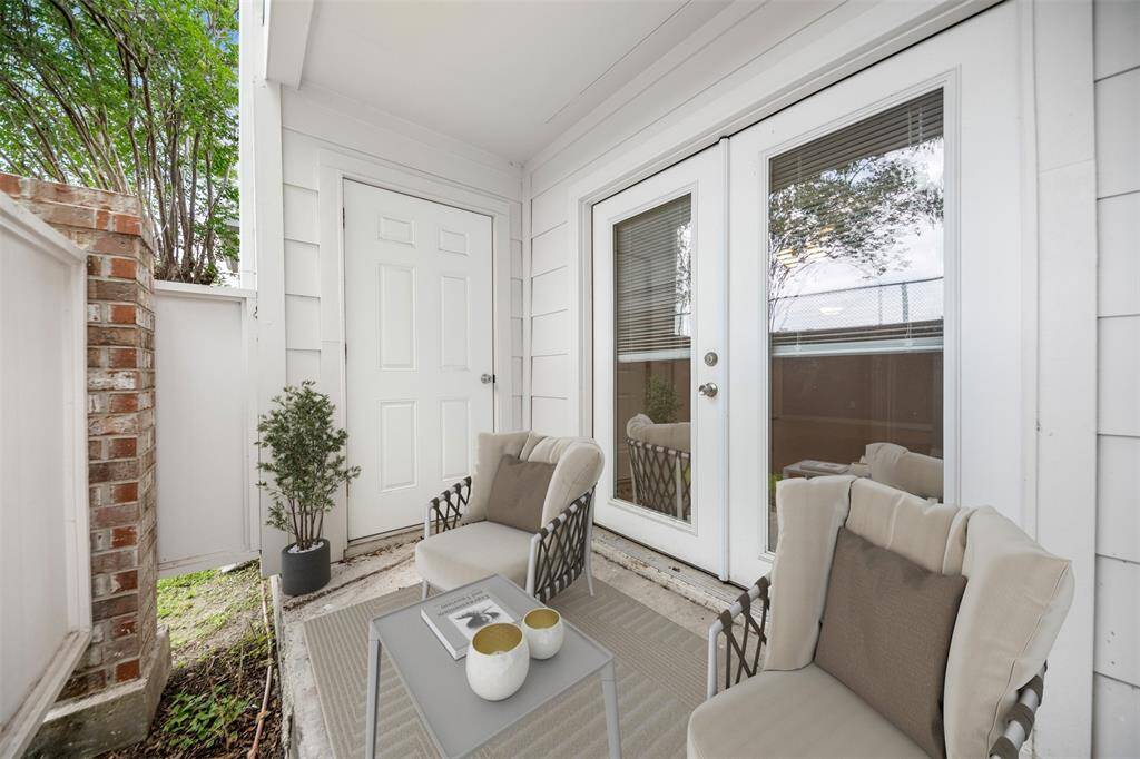 Private fenced-in patio with plenty of space for outdoor relaxation, featuring a convenient storage closet—perfect for keeping your outdoor essentials tucked away while enjoying the fresh air.(This photo is virtually staged)