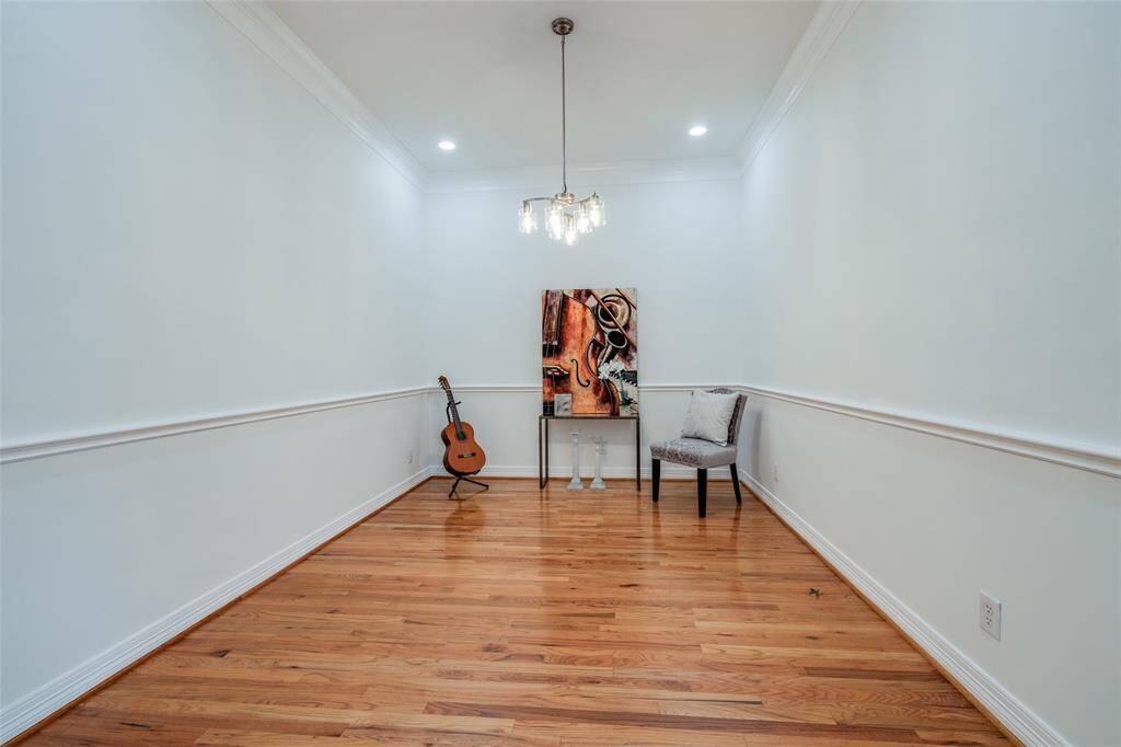 Large Dining room with hardwood floors, gorgeous chandalier