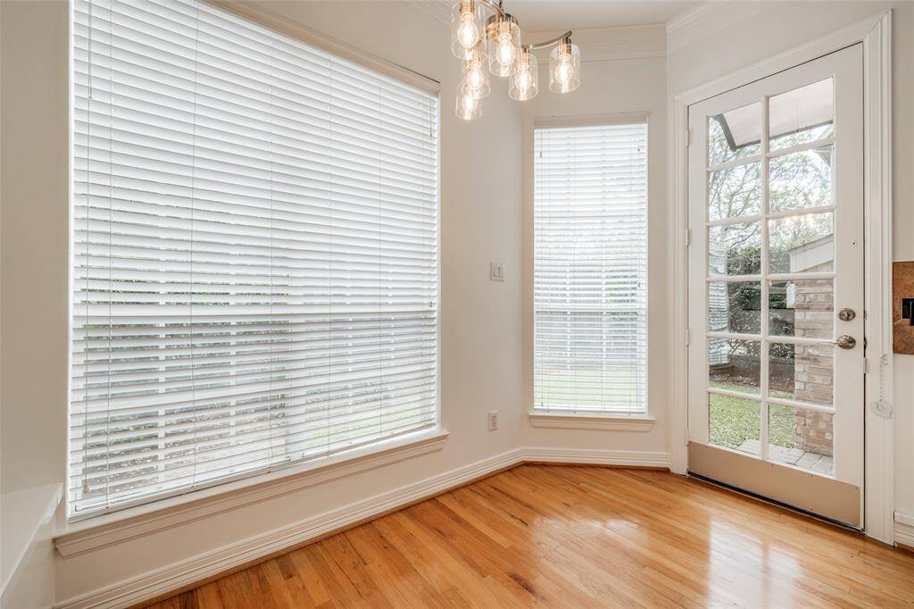 Breakfast nook with fitted seats, door out to back yard , new chandelier