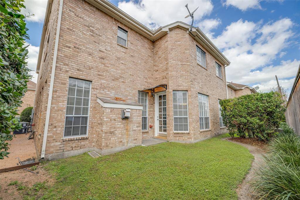 Fabulous back yard with mature landscaping and large grass area