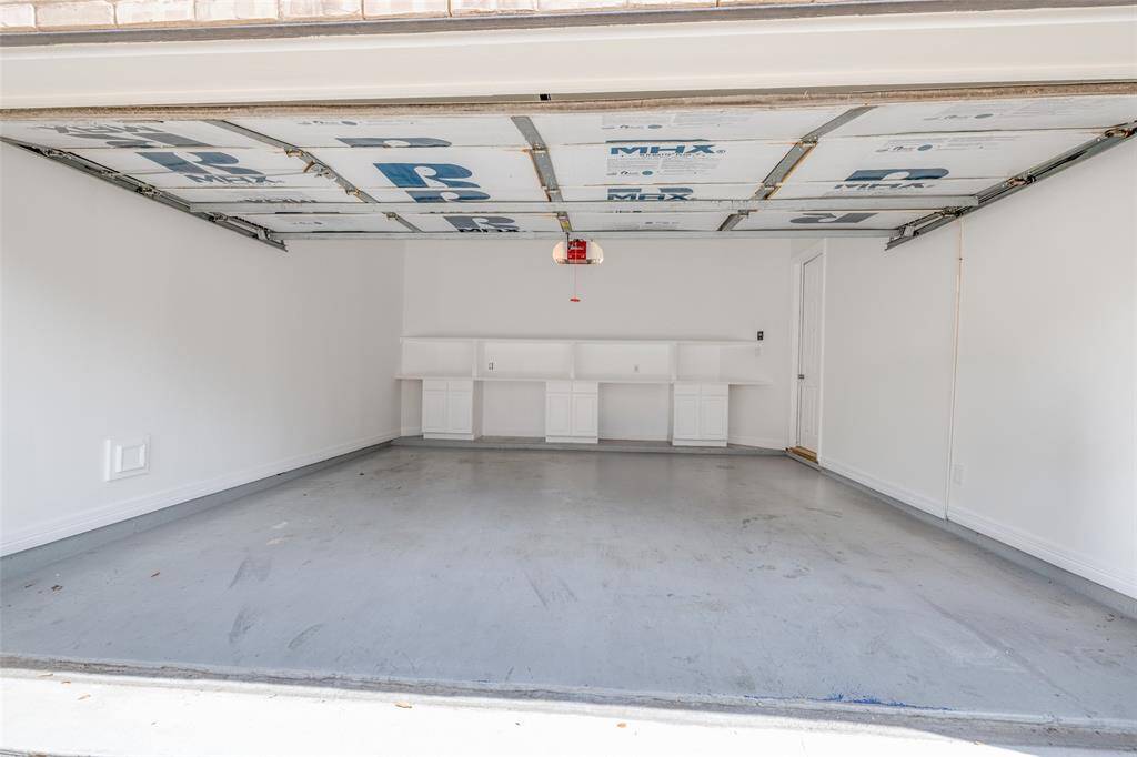 Very nice 2 car garage with recently painted cabinets, epoxy painted floor