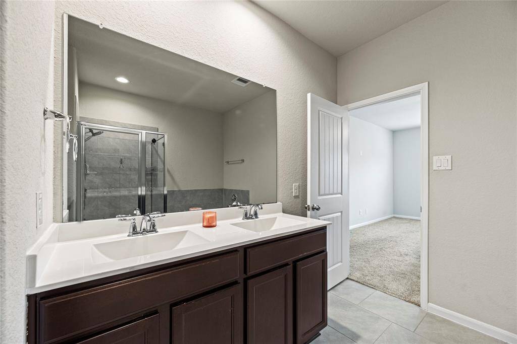 Dual vanities in your primary bath, offer personal space with tons of dedicated cabinet space.
