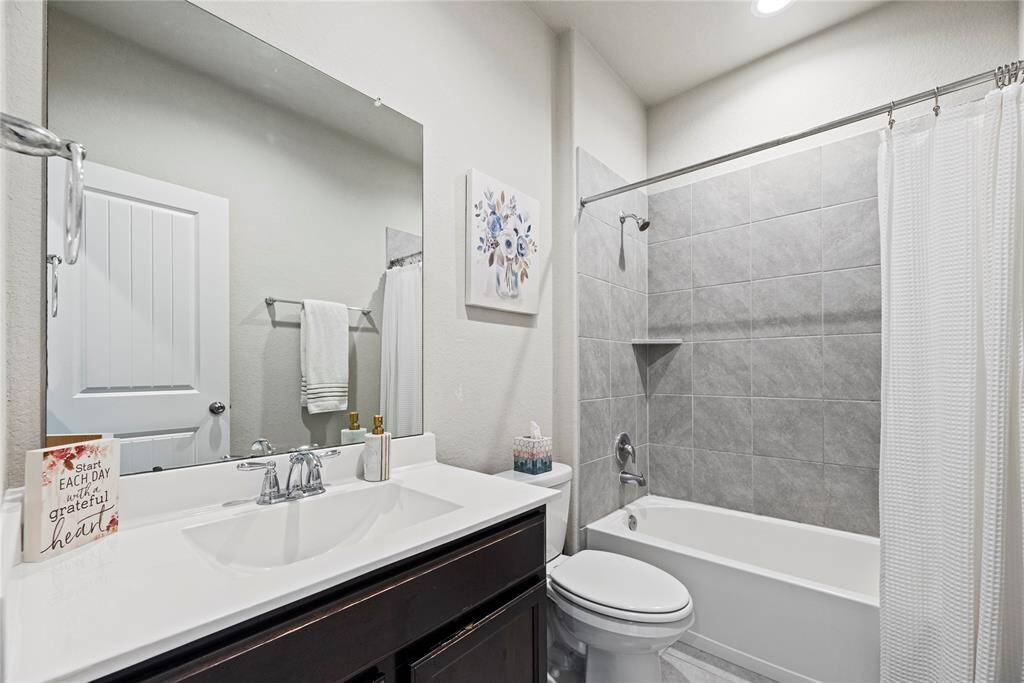 The secondary full downstairs bath ensure privacy for everyone.
