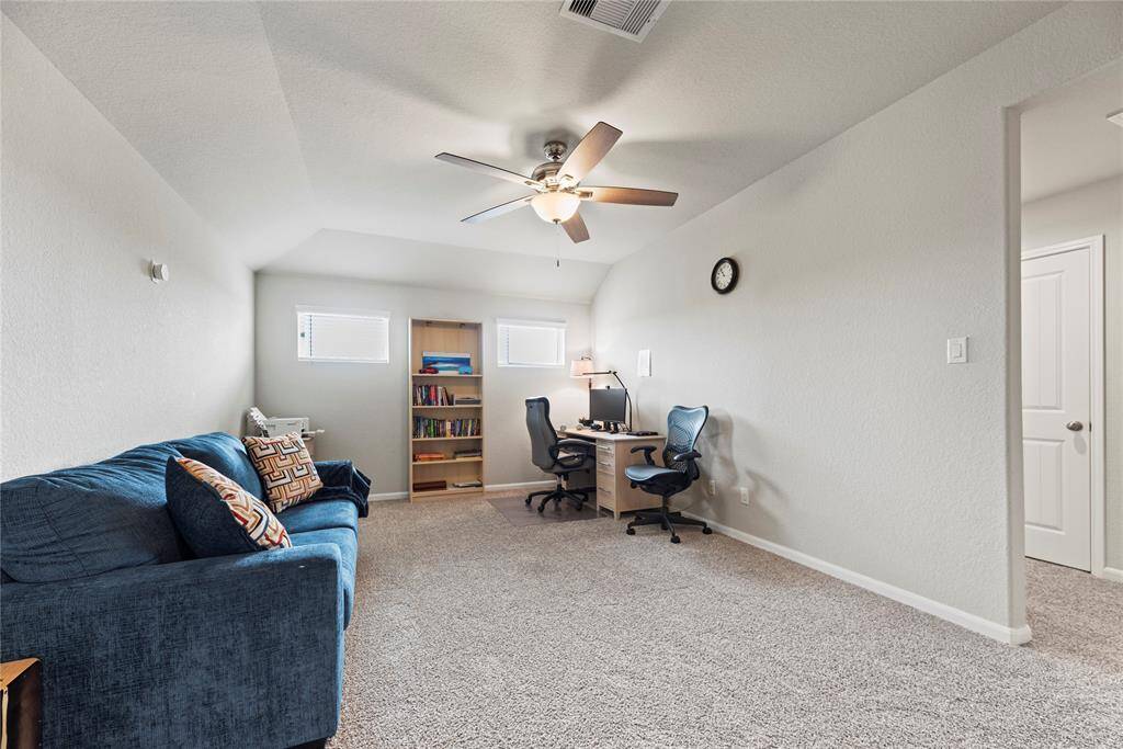 The whole family will love the expansive game room. This is a versatile space perfect for family fun or movie nights.
