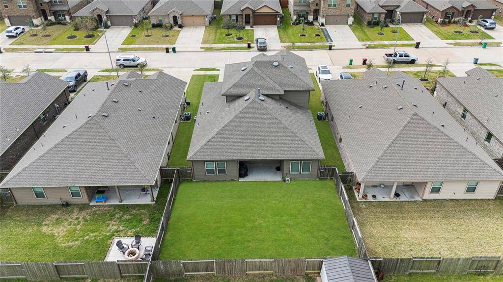 From this aerial view of the back of the home, you can fully appreciate its beauty, elegance, and remarkable charm.