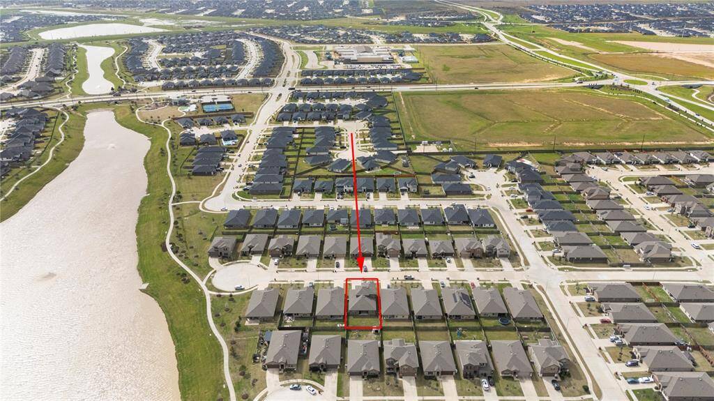 This impressive aerial view showcases the prime location of this lot, perfectly positioned within walking distance to the scenic lake and walking trails.