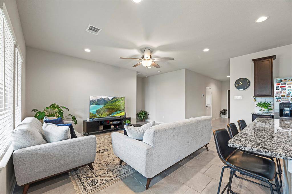 A large living area with a comfortable and inviting feel offers the perfect setting for relaxation and socializing.