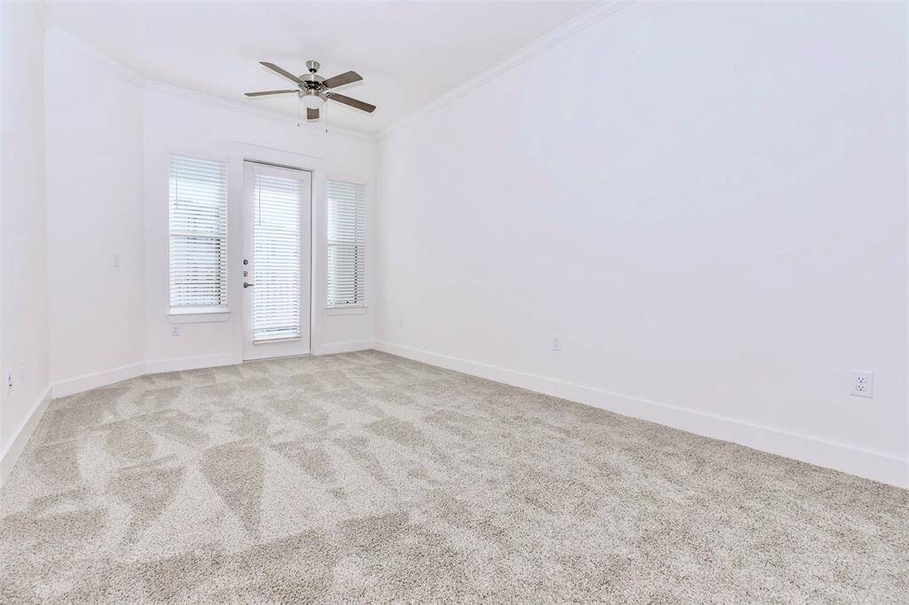 1 Bed + 1 Bath with interior views! Living room with natural light opens to private balcony