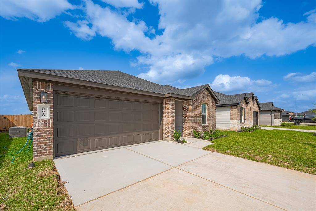 From inside, the front door makes an impression with its clean lines. Soft lighting casts a warm glow, highlighting the subtle textures and inviting atmosphere of the entry.