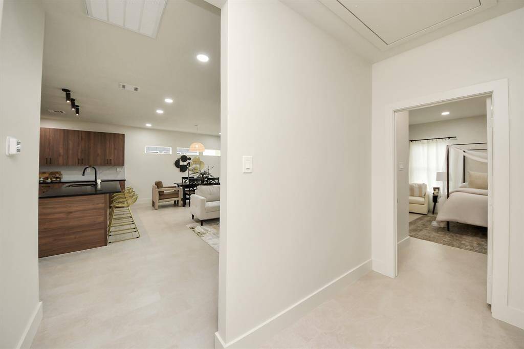 Between the living area and into the primary bedroom.