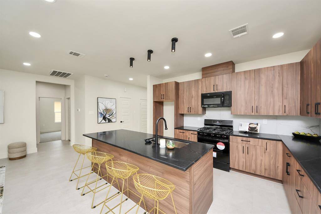 We all know everyone congregates in the kitchen, which is all opened up to the living room.