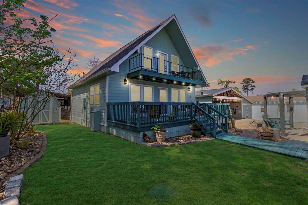 Large deck and balcony! Features include a storage shed, patio seating area, and well-maintained landscaping, wonderful for outdoor enjoyment.
