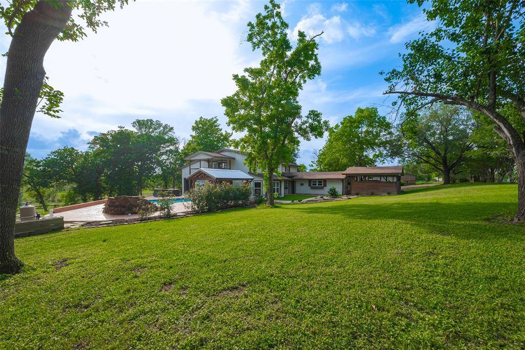 Welcome home to 35523 Pontiac Drive! Nestled in nature, this 3.4-acre estate offers serene views and plenty of outdoor space for activities and relaxation.