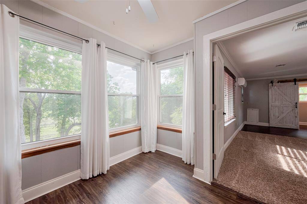 Upstairs, you'll find two more bedrooms, including this one with it's own sitting area overlooking the back of the property.