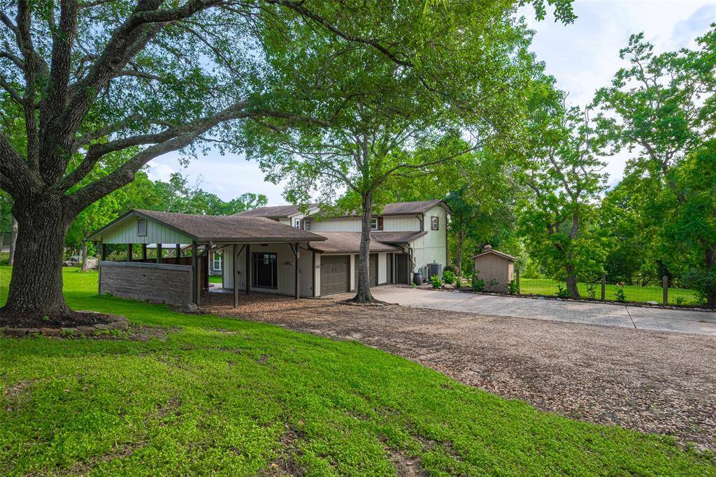 There's plenty of space, including an attached 2-car garage, 2-car covered carport, and oversized driveway!