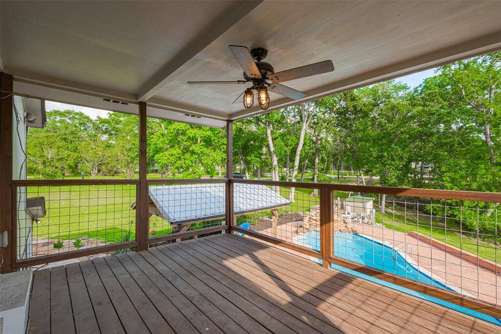 This second-floor balcony provides a shaded outdoor area with views for days!