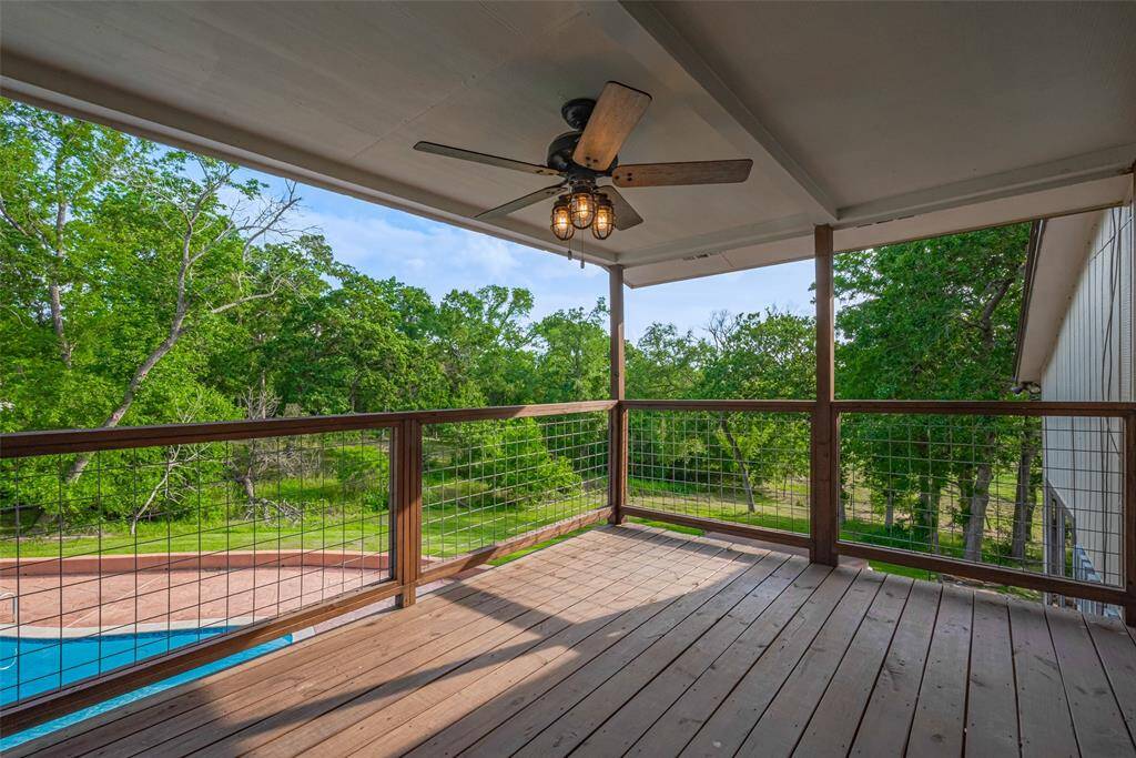 This second-floor balcony provides a shaded outdoor area with views for days!