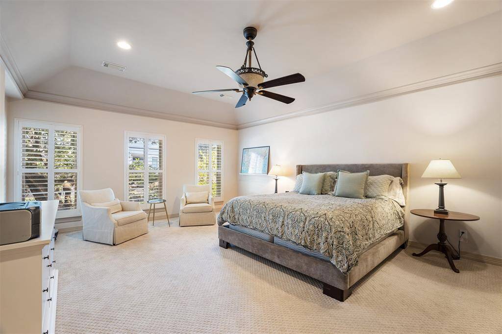 The dining room is  connected to the living room and the kitchen and breakfast room beyond. Great for entertaining!