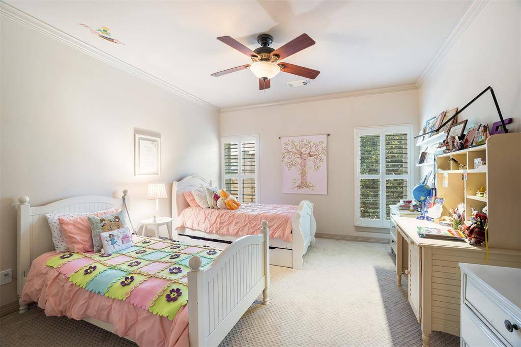 The fourth bedroom suite is located on the third floor . This space offers a full bathroom (not pictured). This space doubles as a game room.
