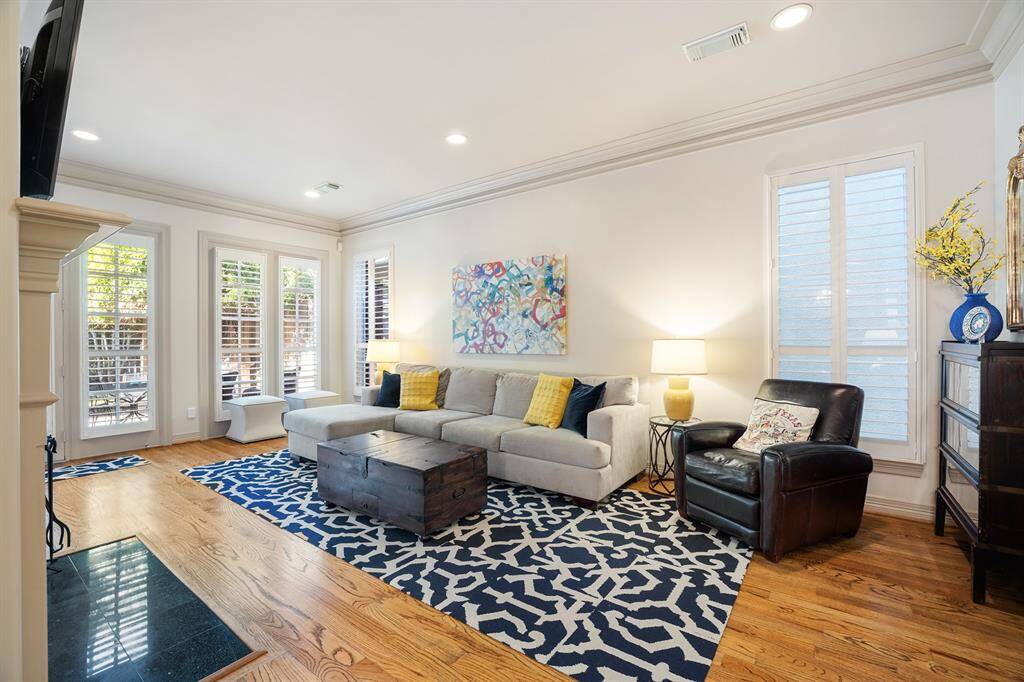 Handsome crown molding and great-looking front door featuring a transom window.